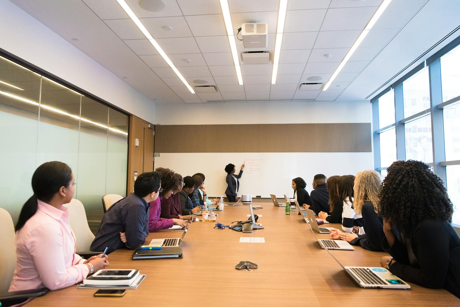 Team members participating in a training session in a boardroom